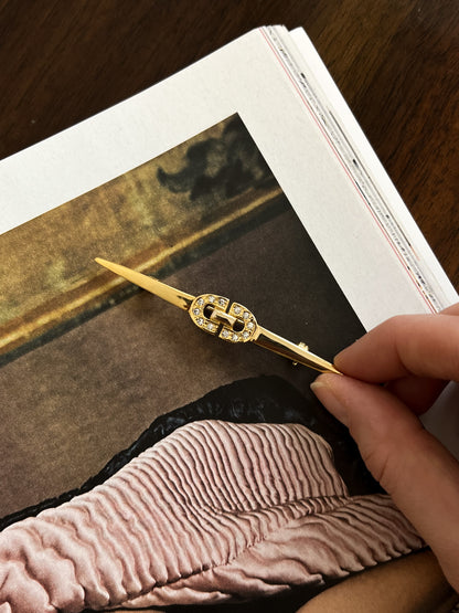 Smukła złota broszka z kryształkam