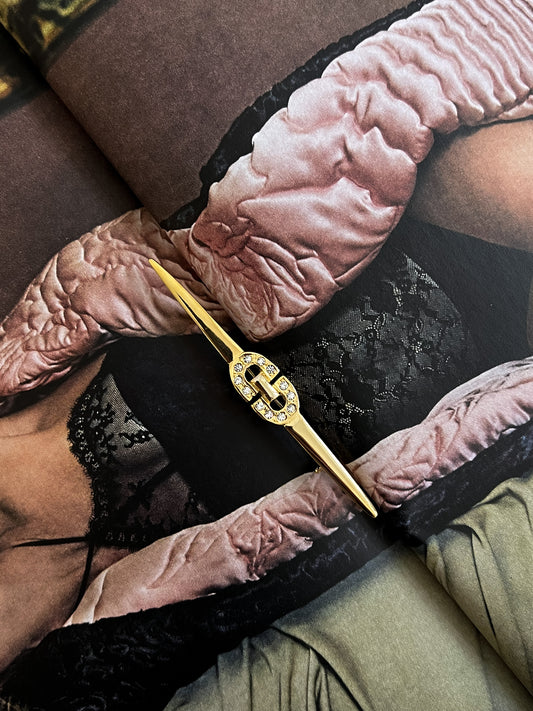 Smukła złota broszka z kryształkam